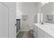 Well-lit bathroom featuring white cabinetry, a dual sink vanity, and a shower with a curtain at 1094 Ambergate Sta, Apex, NC 27502