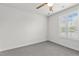 Neutral bedroom with carpet, ceiling fan, and a window with bright natural light at 1094 Ambergate Sta, Apex, NC 27502