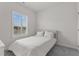 Bedroom with a bed, large window with blinds allowing ample natural light at 1094 Ambergate Sta, Apex, NC 27502