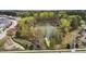 Scenic view of a tranquil lake surrounded by lush greenery and walking trails at 1094 Ambergate Sta, Apex, NC 27502