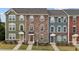 Charming townhomes featuring varied facades, manicured lawns, and inviting entrances at 1094 Ambergate Sta, Apex, NC 27502
