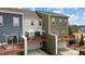 A row of townhomes with wooden decks and attached garages, showcasing modern design at 1094 Ambergate Sta, Apex, NC 27502