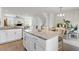 Open kitchen with granite countertops, white cabinetry, and stainless steel appliances at 1094 Ambergate Sta, Apex, NC 27502