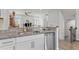 Modern kitchen features granite countertops, stainless steel dishwasher, and open floor plan at 1094 Ambergate Sta, Apex, NC 27502