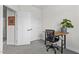 Bright office space with a wooden desk, comfortable chair, and a closet in the background at 1094 Ambergate Sta, Apex, NC 27502