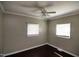 Cozy bedroom featuring hardwood floors, natural light from two windows, and a relaxing atmosphere for rest and rejuvenation at 1220 Garner Rd, Raleigh, NC 27610