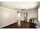 A spacious living room with ceiling fan, hardwood floors and neutral-colored walls, creating a calm and inviting atmosphere at 1220 Garner Rd, Raleigh, NC 27610
