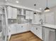 Modern kitchen featuring white cabinets, stainless steel appliances, and pendant lighting at 1234 Coach Station Alley # 101, Raleigh, NC 27601