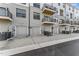 Townhome garages with gray doors and convenient parking, complemented by modern architectural details, and easy street access at 1245 S Blount Street # 201, Raleigh, NC 27601