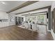 Open living room features wood floors, beamed ceilings, neutral decor and seamless flow at 1245 S Blount Street # 201, Raleigh, NC 27601