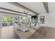 Living area boasts beamed ceilings, wood floors, fireplace, and access to an outdoor balcony at 1245 S Blount Street # 201, Raleigh, NC 27601