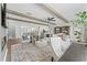 Open-concept living room featuring beamed ceilings, modern furniture, and hardwood floors at 1245 S Blount Street # 201, Raleigh, NC 27601