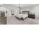 Comfortable main bedroom features neutral decor, carpet floors, and en-suite bathroom access at 1245 S Blount Street # 201, Raleigh, NC 27601