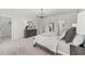 Relaxing main bedroom boasts carpet floors, chandelier lighting and en-suite bathroom access at 1245 S Blount Street # 201, Raleigh, NC 27601