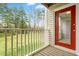 Balcony overlooking a grassy area and trees at 1300 Hillbrow Ln # 204, Raleigh, NC 27615