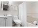 Clean bathroom with vanity, toilet, mirror, and shower with white curtain at 1300 Hillbrow Ln # 204, Raleigh, NC 27615