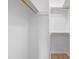A bright closet space with wood closet rod and ample shelving at 1300 Hillbrow Ln # 204, Raleigh, NC 27615