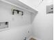 Utility room with gas pipes, wall outlet, wiring, and shelf at 1300 Hillbrow Ln # 204, Raleigh, NC 27615