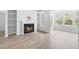 Spacious living room with a fireplace and views of the outdoors at 1300 Hillbrow Ln # 204, Raleigh, NC 27615
