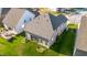 Aerial shot of backyard featuring a screened porch and lush green lawn at 1301 Elliott Ridge Ln, Morrisville, NC 27560