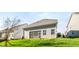 View of backyard featuring a well-manicured lawn and view of the rear house elevation at 1301 Elliott Ridge Ln, Morrisville, NC 27560