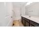 Bright bathroom offering a vanity, bathtub, and shower combination for versatile bathing options at 1301 Elliott Ridge Ln, Morrisville, NC 27560