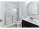 Bathroom featuring a glass shower, modern vanity, and tile floor at 1301 Elliott Ridge Ln, Morrisville, NC 27560