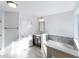 This primary bathroom has dual vanities, soaking tub and walk-in shower at 1301 Elliott Ridge Ln, Morrisville, NC 27560