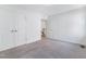 Bedroom featuring carpet flooring, natural light, and access to additional rooms at 1301 Elliott Ridge Ln, Morrisville, NC 27560