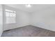 Cozy bedroom featuring neutral carpet, white walls, and a window at 1301 Elliott Ridge Ln, Morrisville, NC 27560