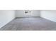 Finished bedroom features neutral carpet, white walls, and a window view at 1301 Elliott Ridge Ln, Morrisville, NC 27560