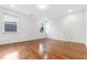 This bedroom has wood floors, a double-hung window and neutral paint at 1301 Elliott Ridge Ln, Morrisville, NC 27560