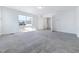 Spacious bedroom with carpet flooring, a large window view, and a walk in closet at 1301 Elliott Ridge Ln, Morrisville, NC 27560