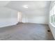 This bonus room has neutral carpet and lots of natural light at 1301 Elliott Ridge Ln, Morrisville, NC 27560