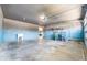 Spacious garage with ample storage shelving, utility sink, and painted walls at 1301 Elliott Ridge Ln, Morrisville, NC 27560