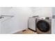 Modern laundry room equipped with stainless steel washer and dryer for efficient laundry care at 1301 Elliott Ridge Ln, Morrisville, NC 27560