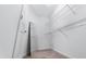 Walk-in closet with a mirror, and built-in wire shelving for organizing clothes and accessories at 1301 Elliott Ridge Ln, Morrisville, NC 27560