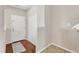 Bright foyer with hardwood floors, a coat closet, and a white front door enhancing the home's appeal at 1304 Cozart St # 258, Durham, NC 27704