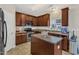 Cozy kitchen featuring wooden cabinets, stainless steel appliances, and a functional center island at 1304 Cozart St # 258, Durham, NC 27704