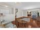Spacious living area featuring hardwood floors, a staircase, and an open layout to the kitchen at 1304 Cozart St # 258, Durham, NC 27704