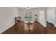 Comfortable living area with rich hardwood floors, a decorative rug, and a cozy reading chair at 1304 Cozart St # 258, Durham, NC 27704