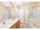 Bathroom with double sinks, tub, and a separate walk-in shower at 1311 Canyon Rock Ct # 105, Raleigh, NC 27610