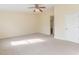 Spacious bedroom featuring neutral paint, carpet flooring, and ample natural light at 1311 Canyon Rock Ct # 105, Raleigh, NC 27610