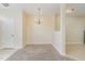 Open dining area with chandelier lighting and convenient access to other rooms at 1311 Canyon Rock Ct # 105, Raleigh, NC 27610