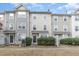 Townhome community features nicely landscaped yards and sidewalks at 1311 Canyon Rock Ct # 105, Raleigh, NC 27610