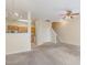 Inviting living room with carpet and ceiling fan opens to the kitchen at 1311 Canyon Rock Ct # 105, Raleigh, NC 27610