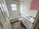 Clean bathroom featuring a tub-shower, vanity, and natural light through window at 1324 Buffalo Rd, Smithfield, NC 27577