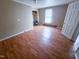 Bright bedroom featuring wood laminate flooring and ample natural light at 1324 Buffalo Rd, Smithfield, NC 27577