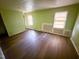 Spacious bedroom featuring hardwood floors and natural light from large windows at 1324 Buffalo Rd, Smithfield, NC 27577