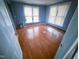 Cozy bedroom with hardwood floors, large window, and fresh paint at 1324 Buffalo Rd, Smithfield, NC 27577